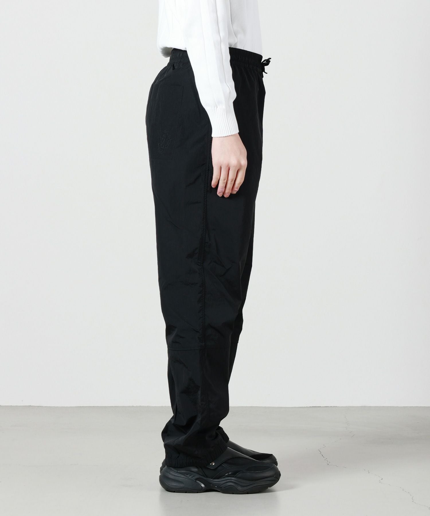 JW Anderson(ジェイダブリューアンダーソン)】 トラックパンツ